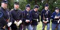 Civil War re-enacters in uniform and armaments