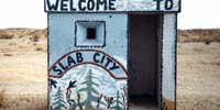 Hut with Welcome to Slab City sign