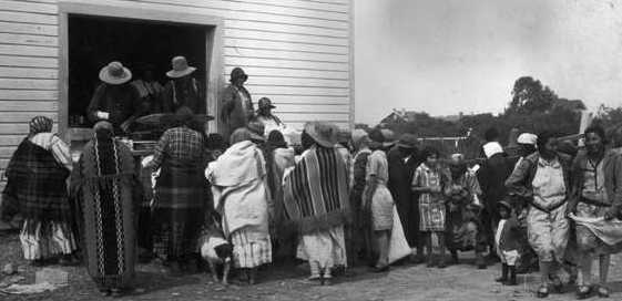 People queue to receive goods