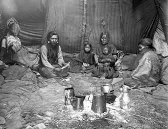 Family inside teepee