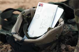 Detail of Operation Homecoming booklet cover; helmet with letters in it.